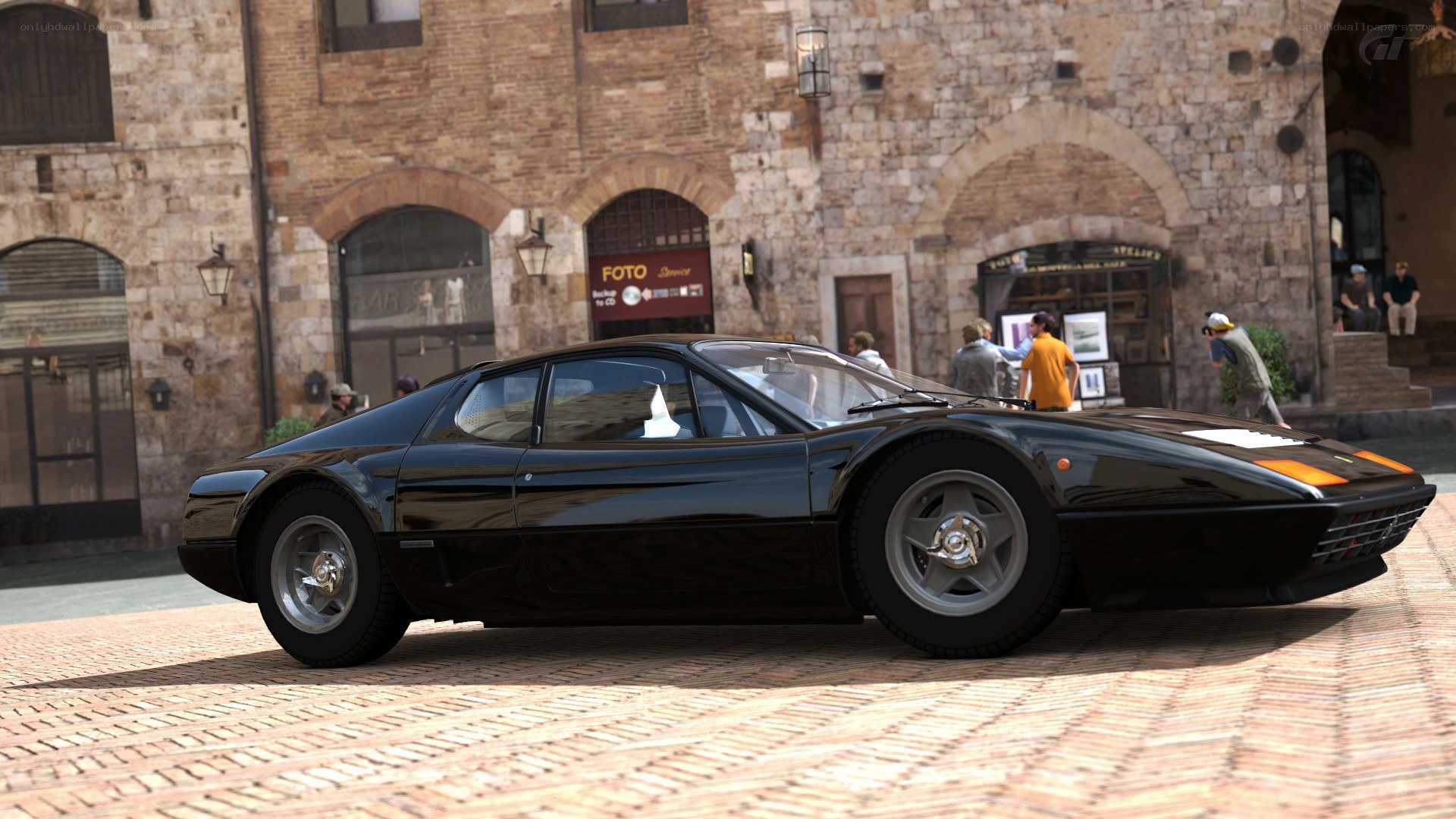 Black Ferrari in a town square