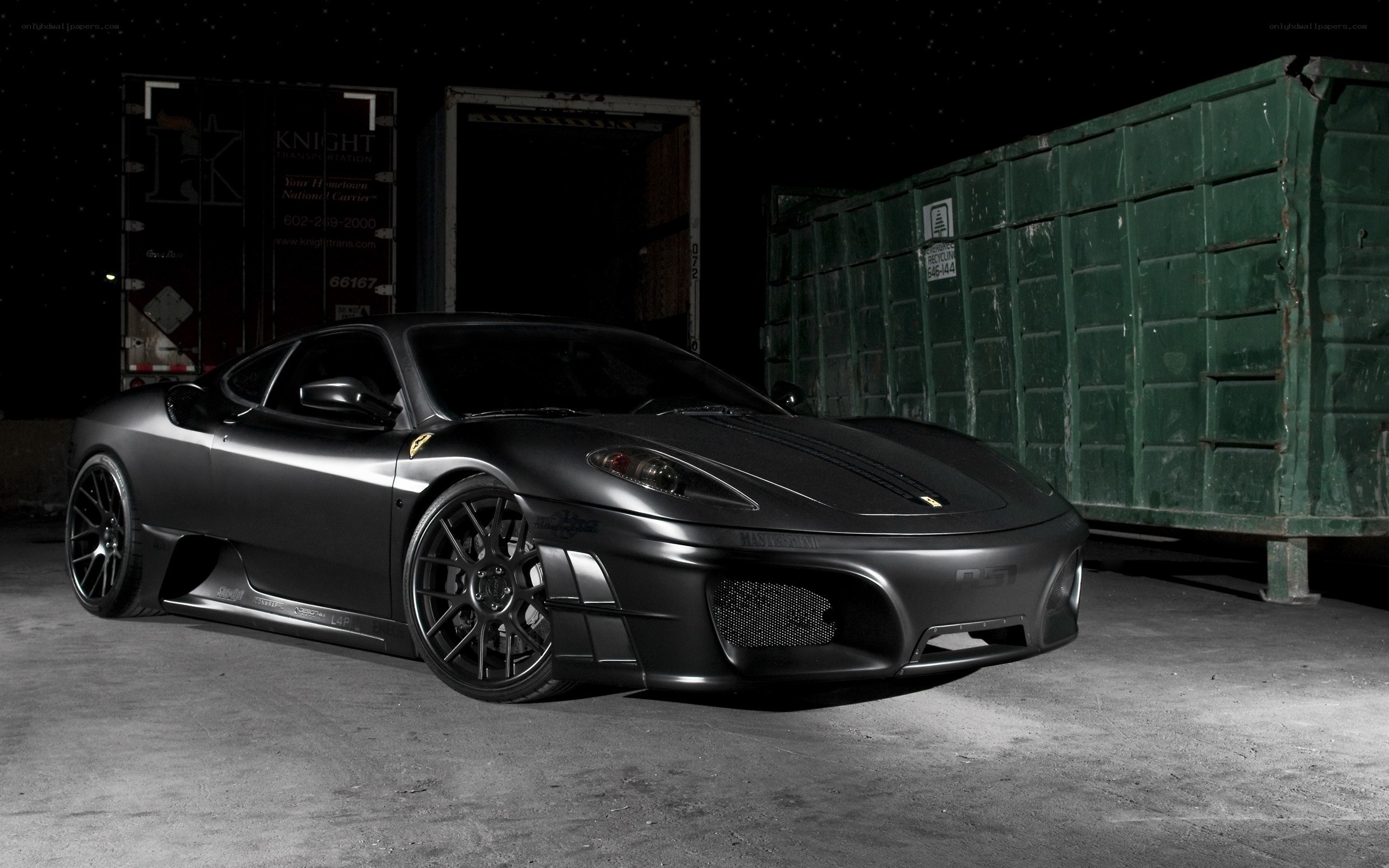 Black Ferrari in a warehouse