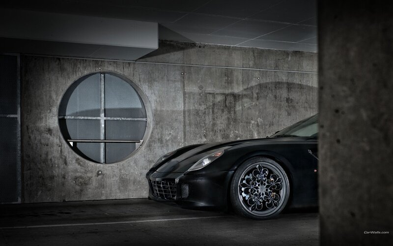 Black Ferrari in concrete garage
