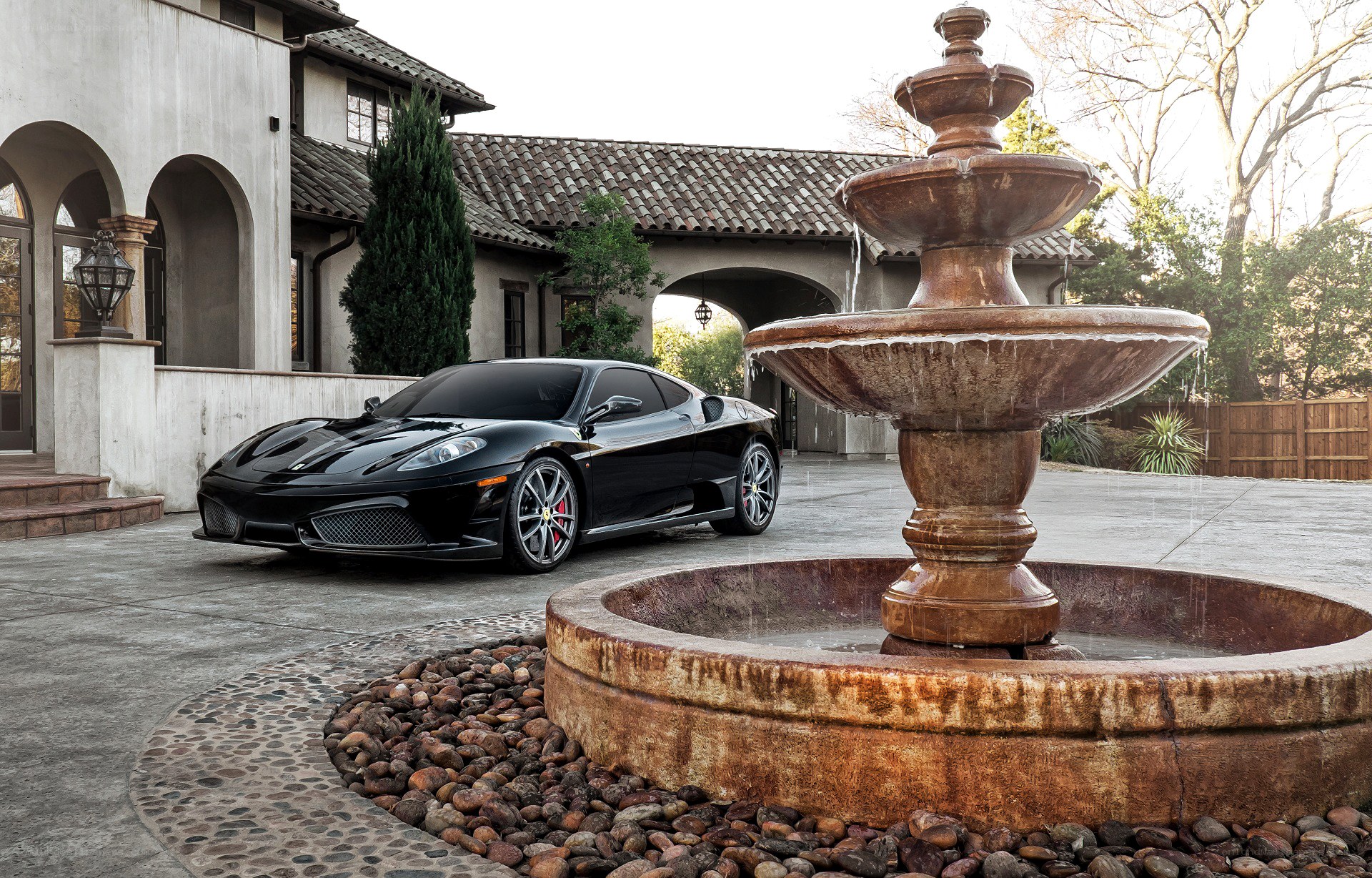 Black Ferrari in courtyard