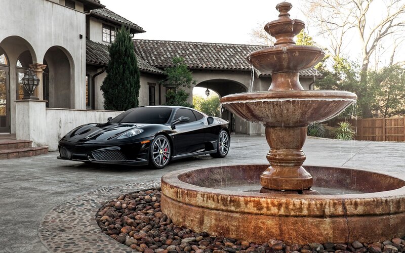 Black Ferrari in Driveway — Serene