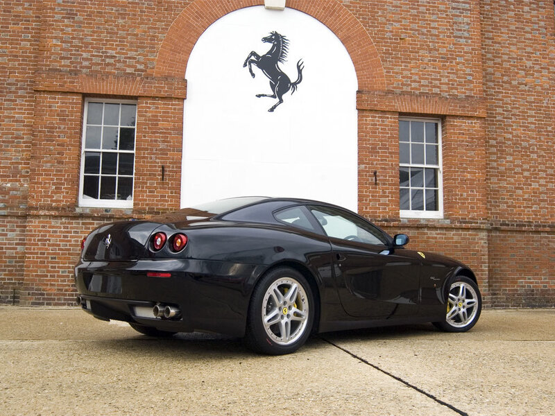 Black Ferrari in front of building