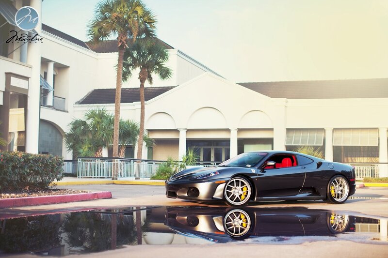 Black Ferrari in front of building