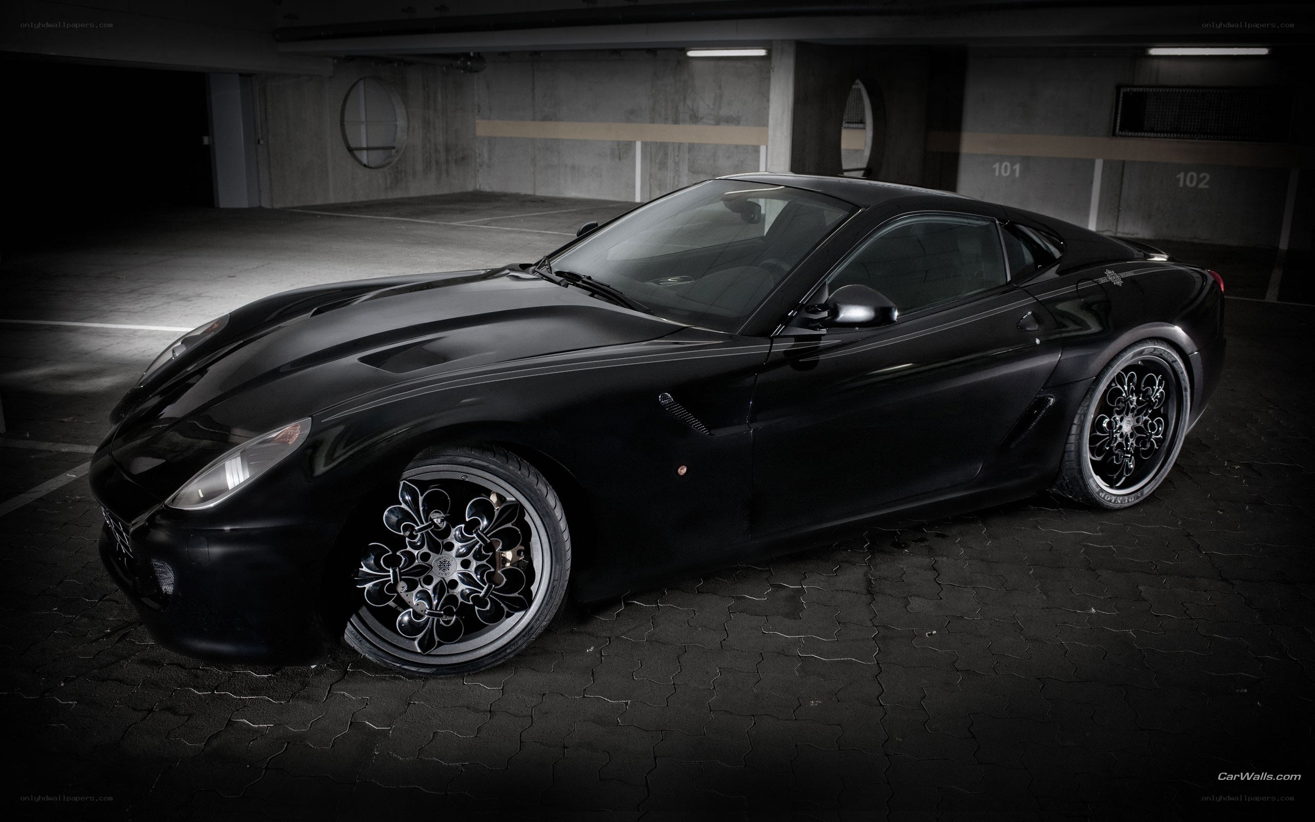 black ferrari in garage