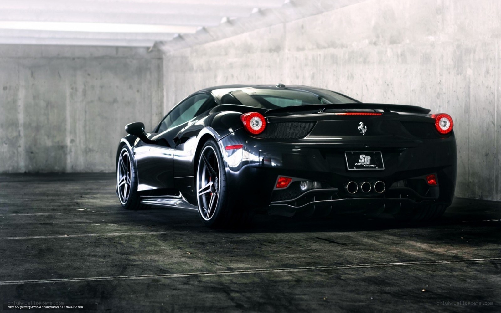 black ferrari in garage