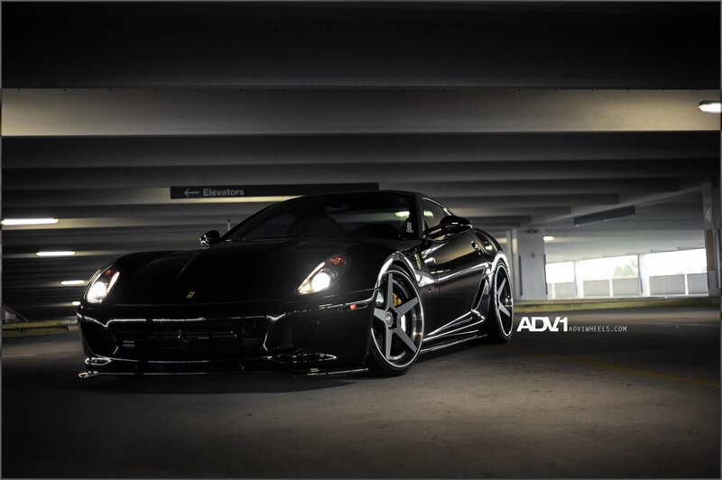 Black Ferrari in parking garage