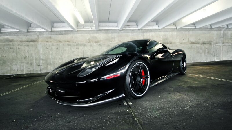 Black Ferrari in parking garage