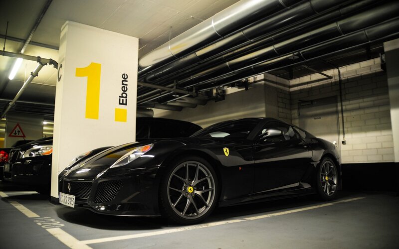Black Ferrari in parking garage