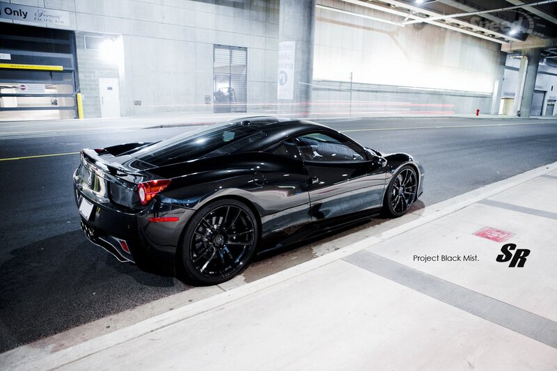 Black Ferrari in parking garage