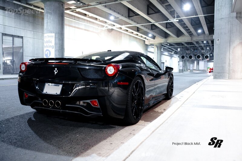 Black Ferrari in parking garage