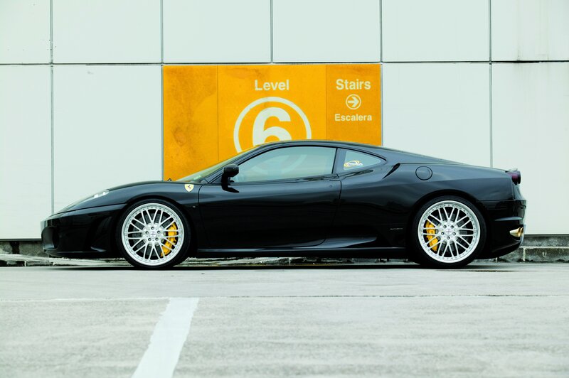 Black Ferrari in parking garage