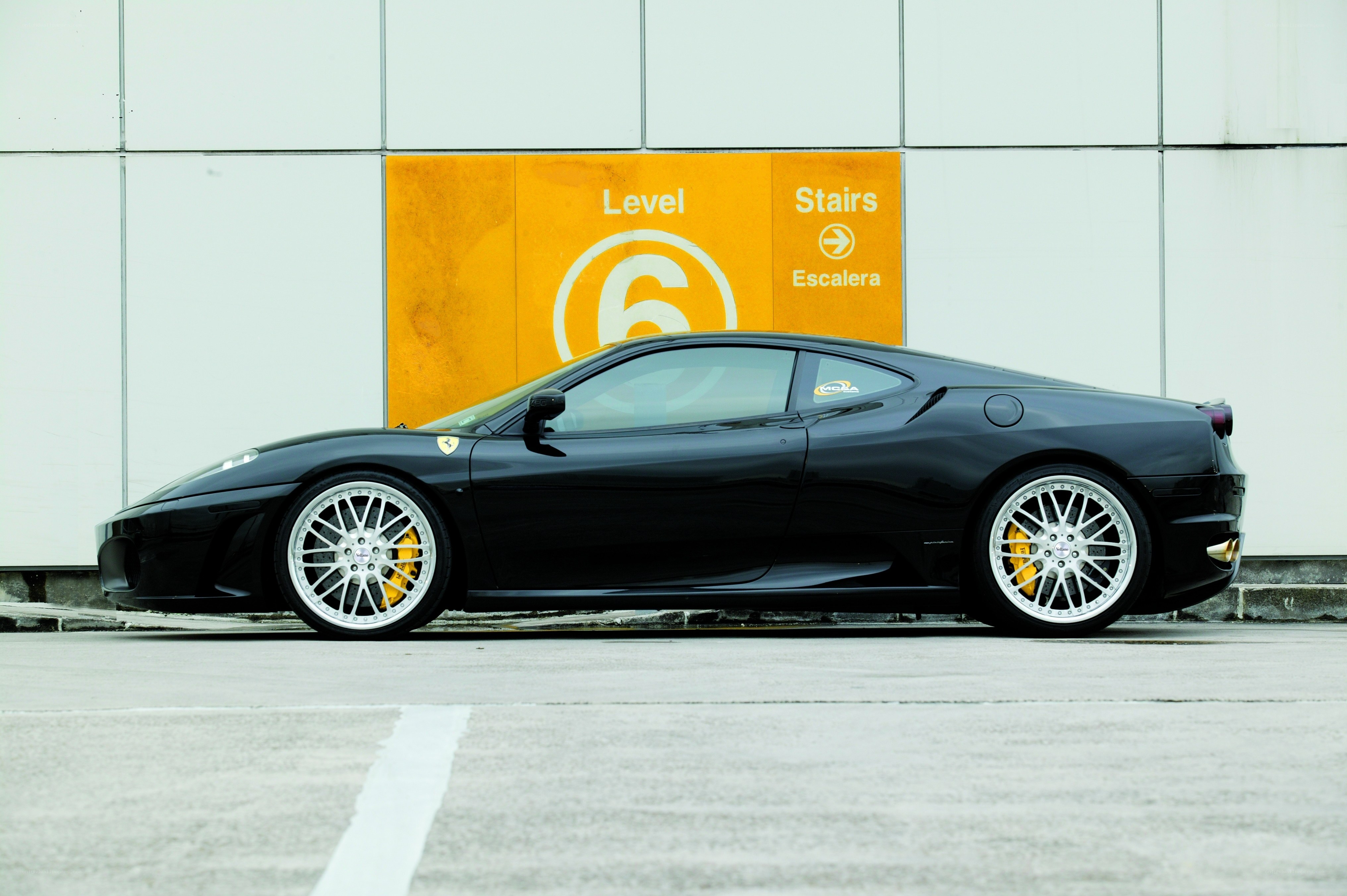 Black Ferrari in parking garage