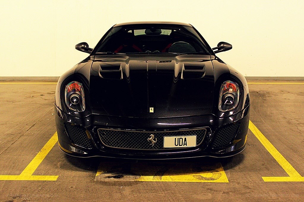 black ferrari in parking space
