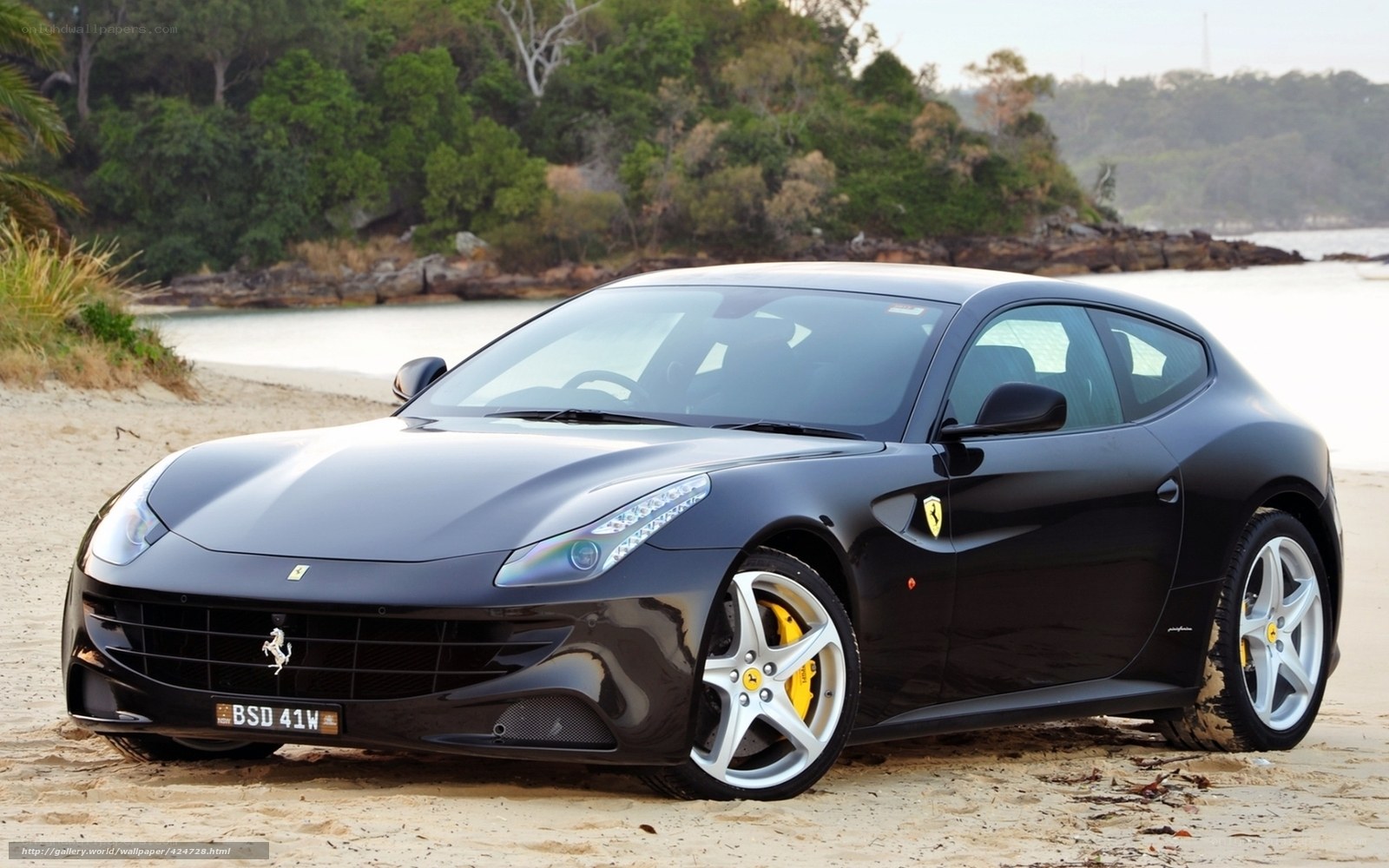 Black Ferrari on a beach
