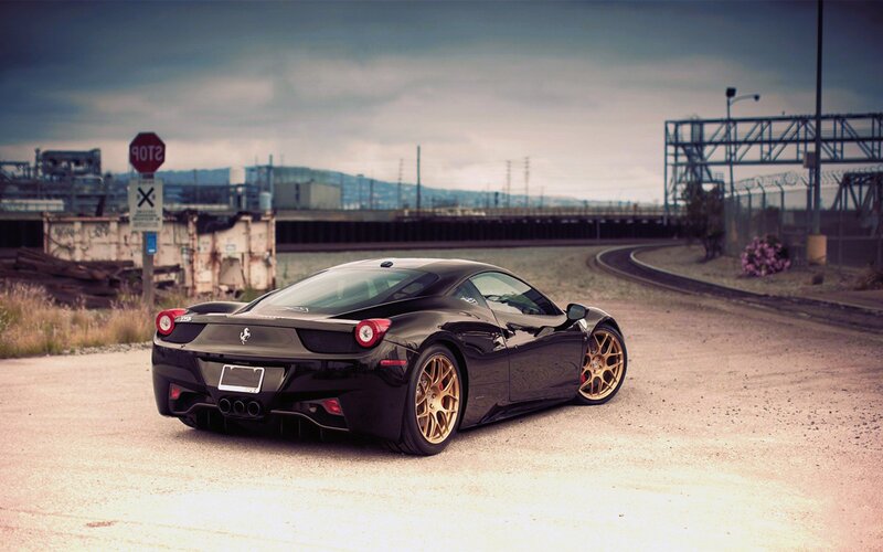 Black Ferrari on a dirt road