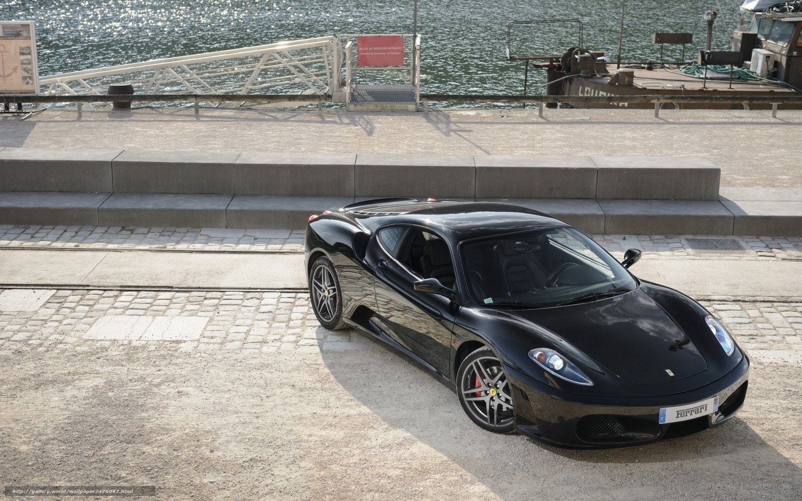 Black Ferrari on a dock