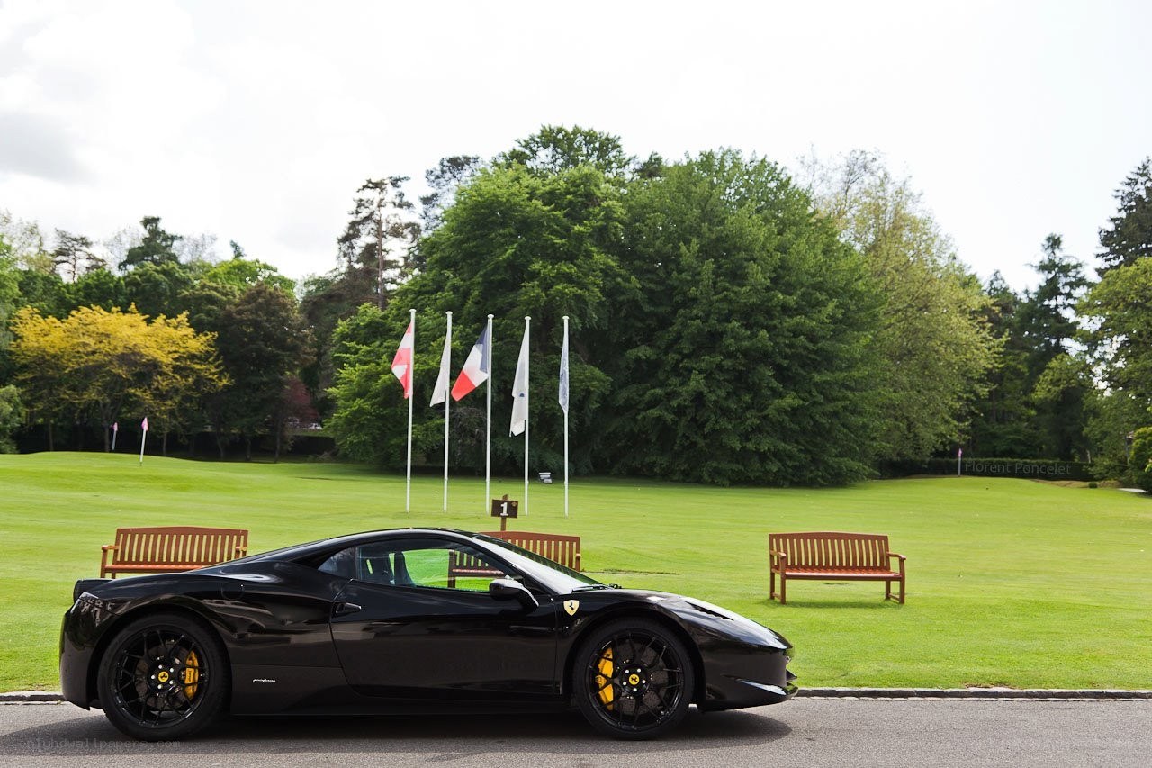 Black Ferrari on a golf course