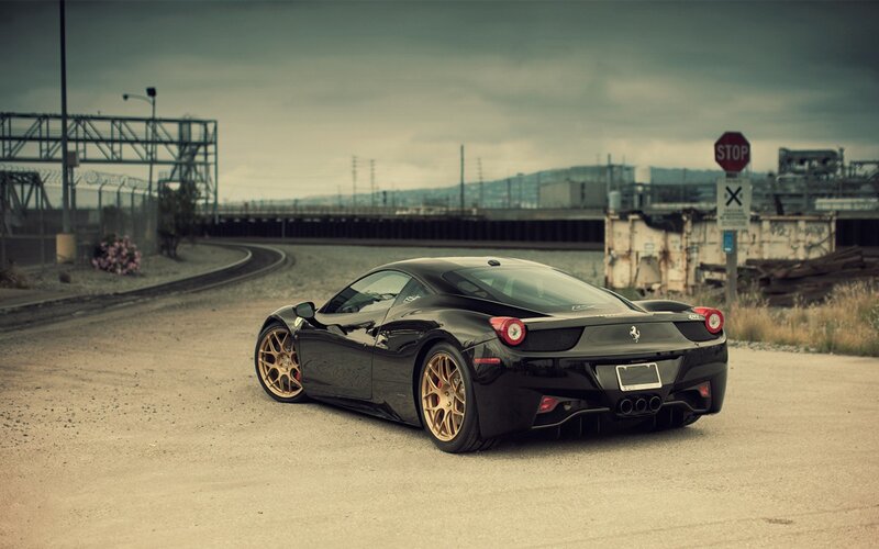 Black Ferrari on a gravel road