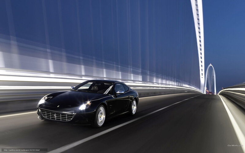 Black Ferrari on a modern bridge