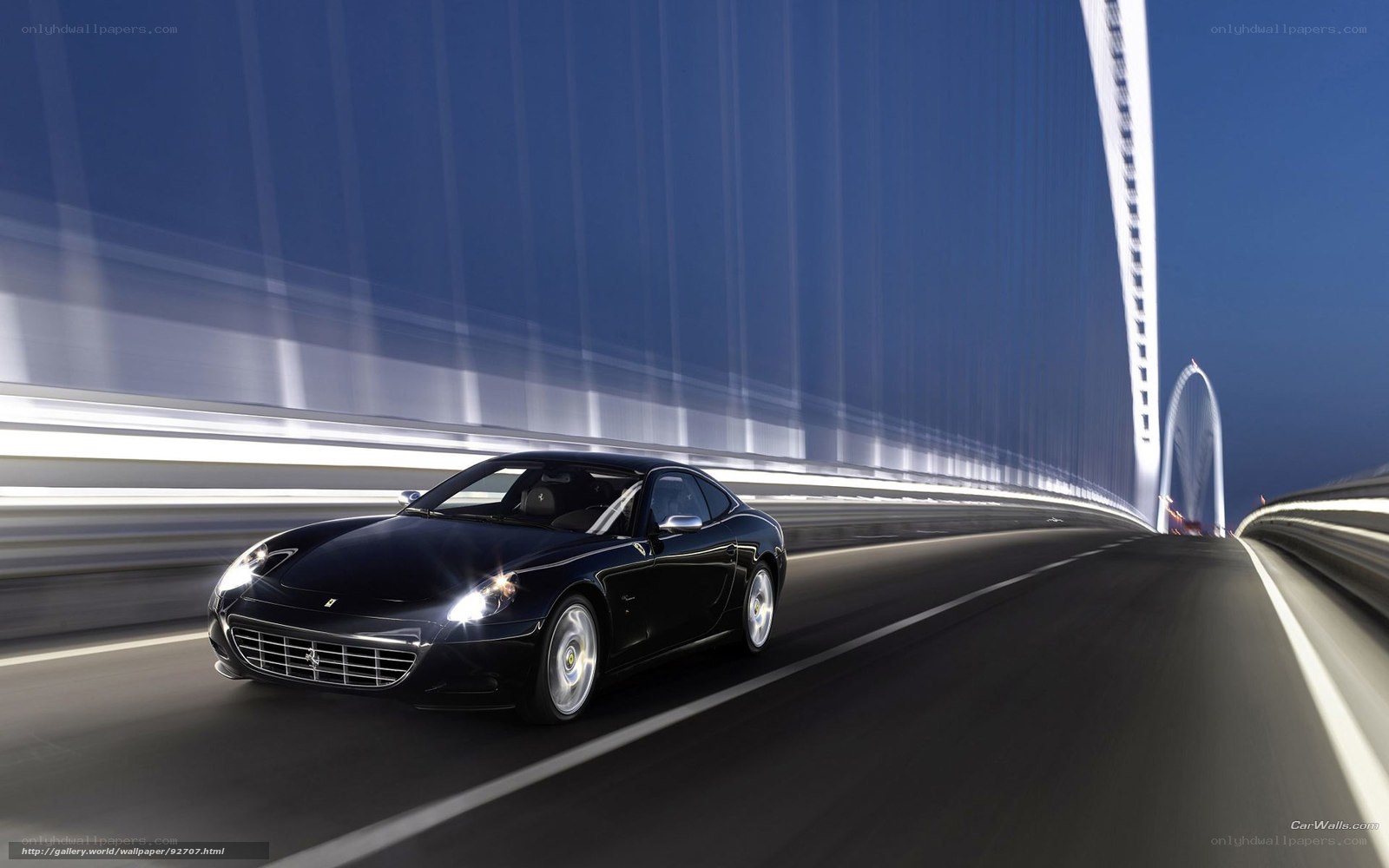Black Ferrari on a modern bridge
