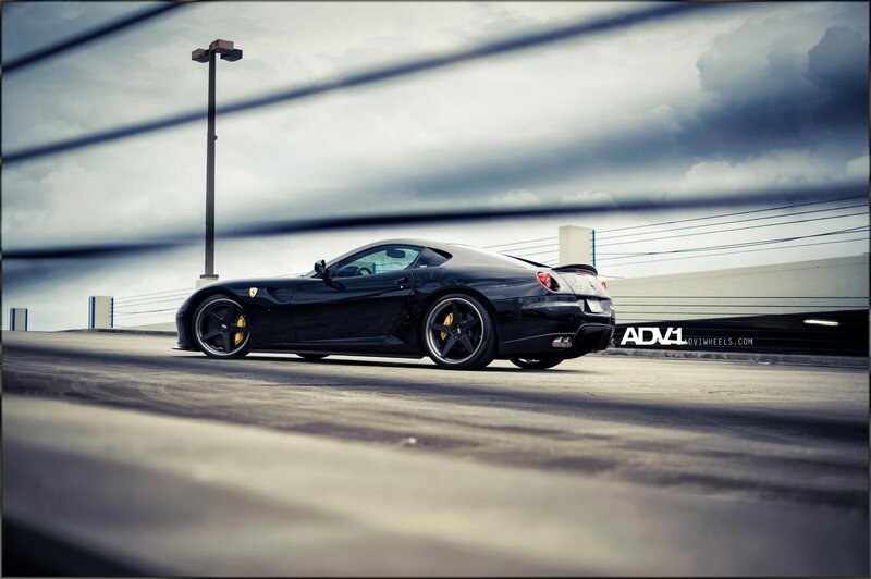black ferrari on a parking deck