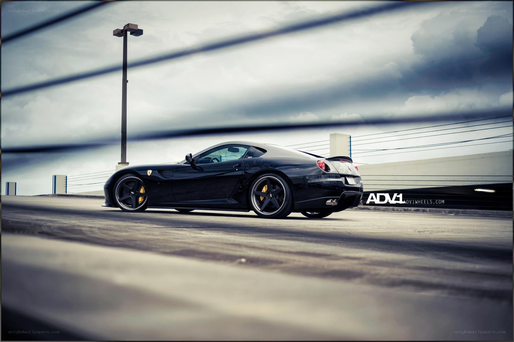 black ferrari on a parking deck