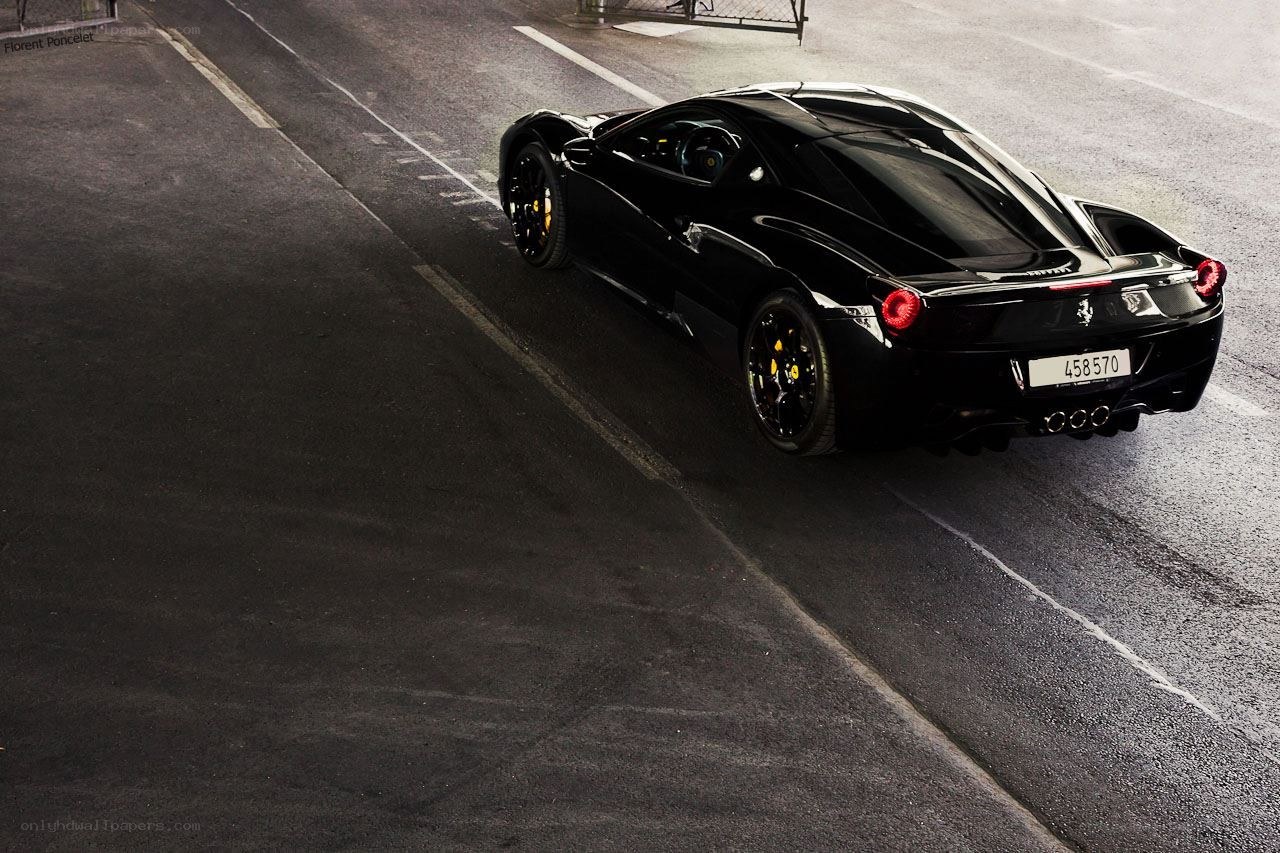 Black Ferrari on asphalt