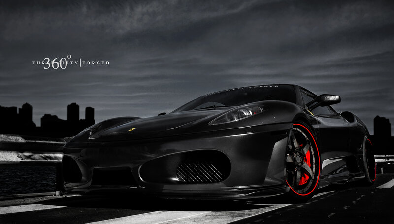 Black Ferrari on city bridge