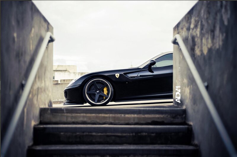 Black Ferrari on concrete stairs