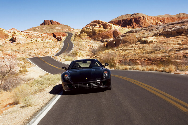 Black Ferrari on desert road