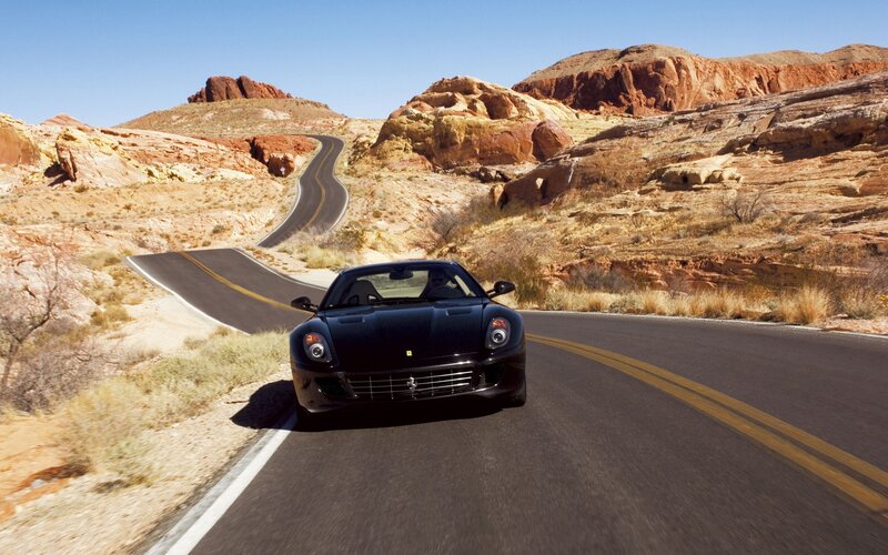 Black Ferrari on desert road