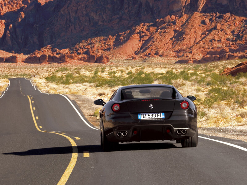 Black Ferrari on desert road