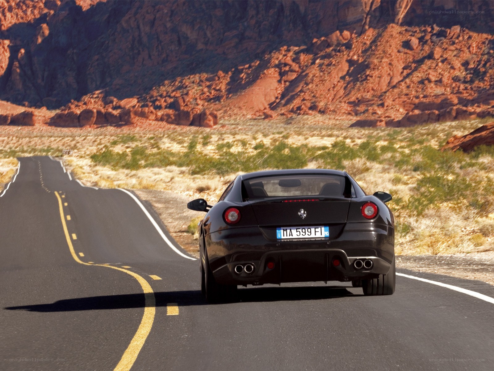 Black Ferrari on desert road