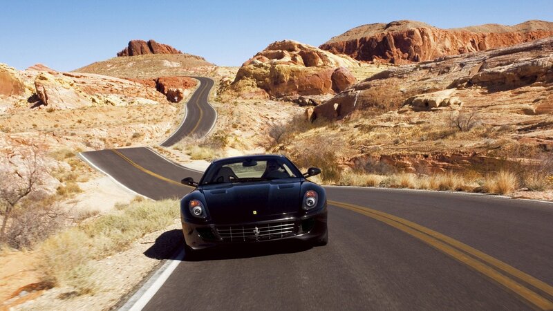 Black Ferrari on desert road