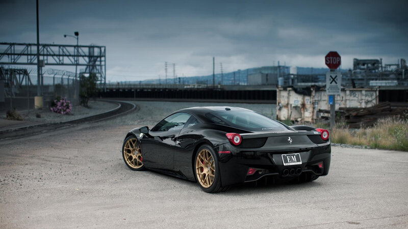 Black Ferrari on industrial road