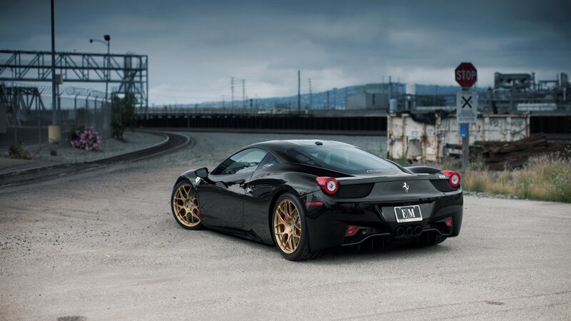 black ferrari on industrial road