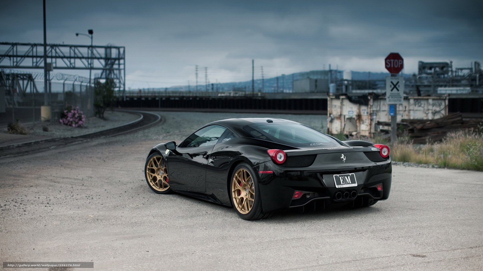 Black Ferrari on industrial road