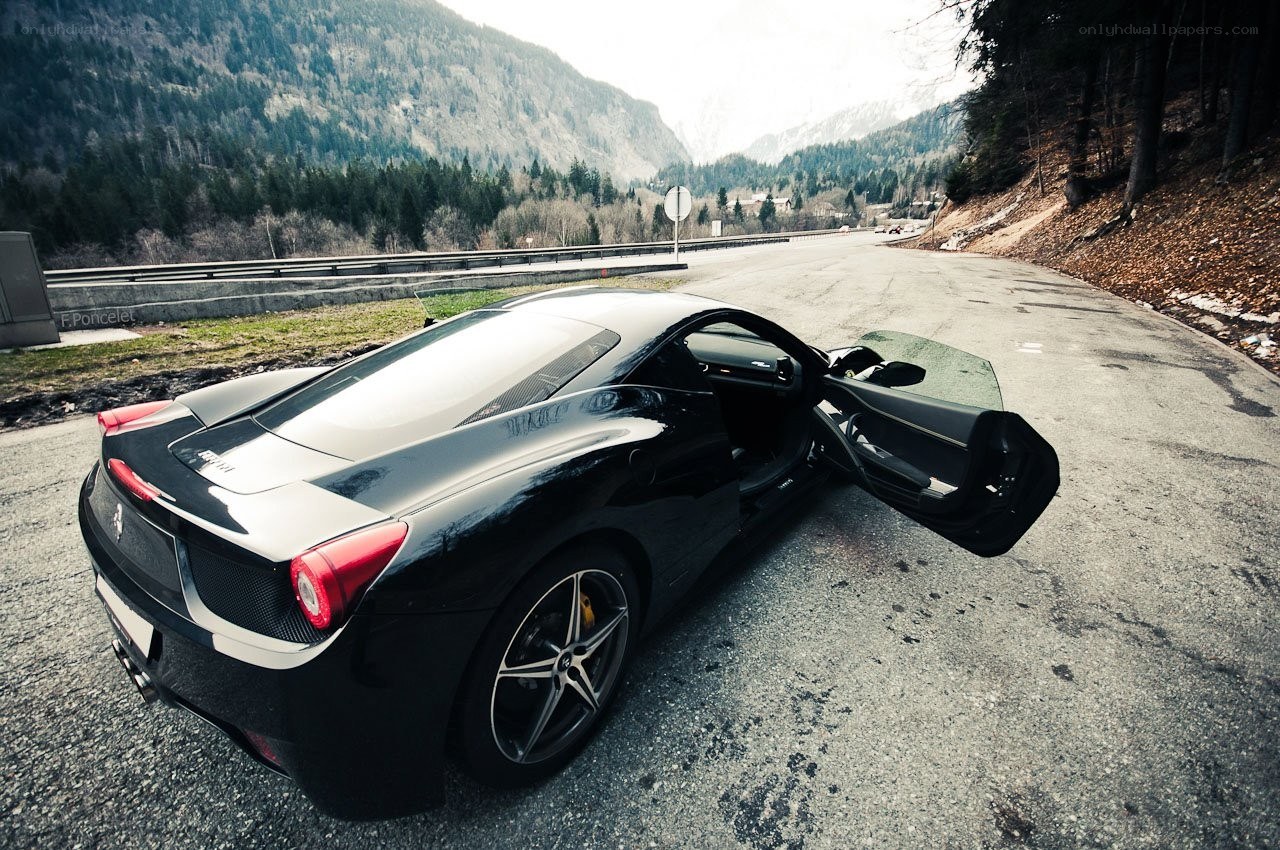 Black Ferrari on mountain road