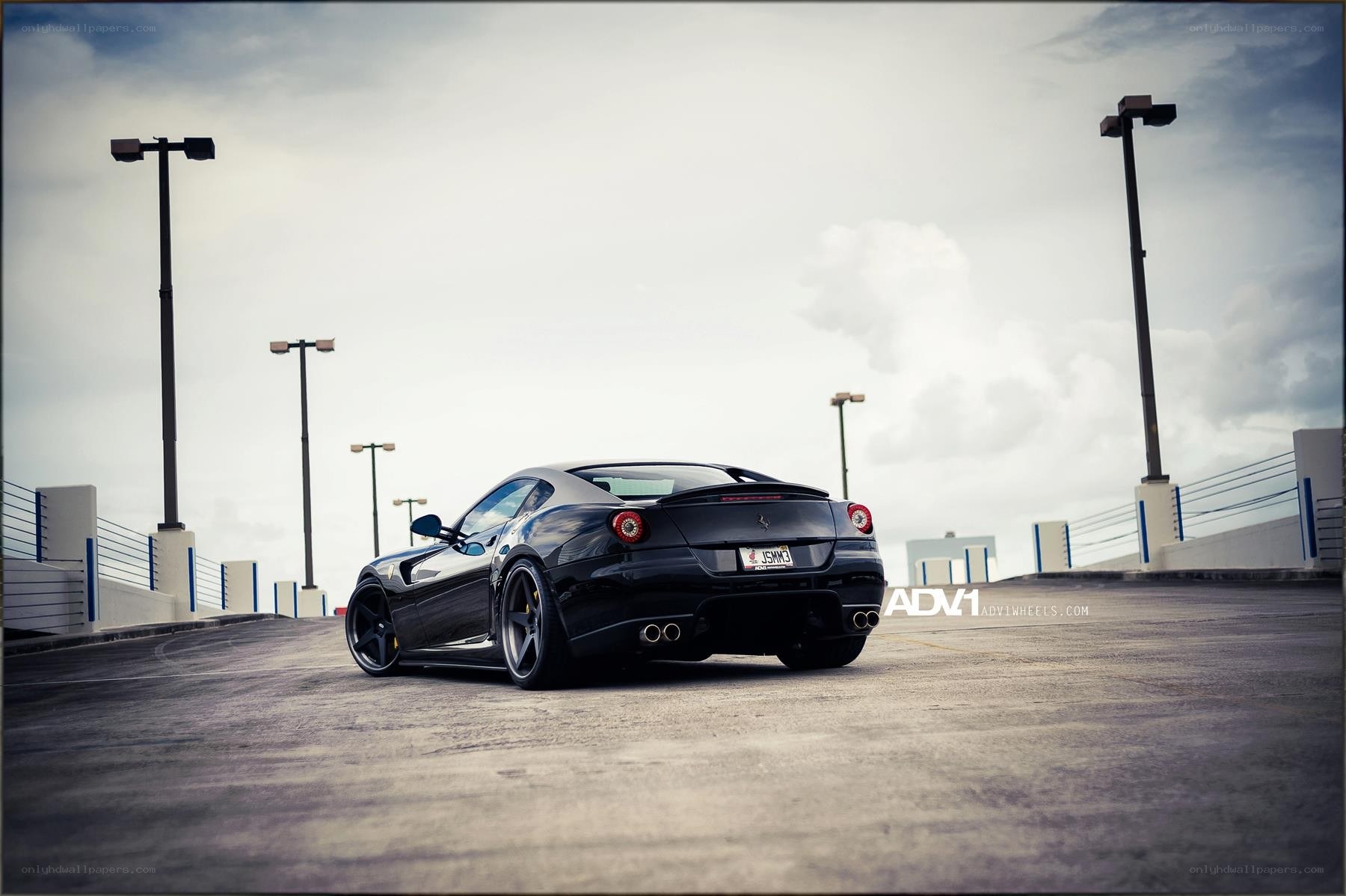 black ferrari on parking deck
