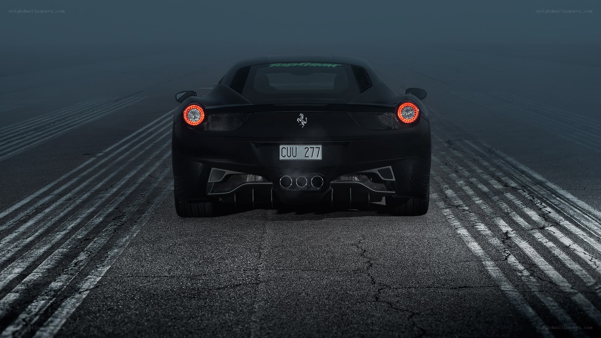 Black Ferrari on racetrack