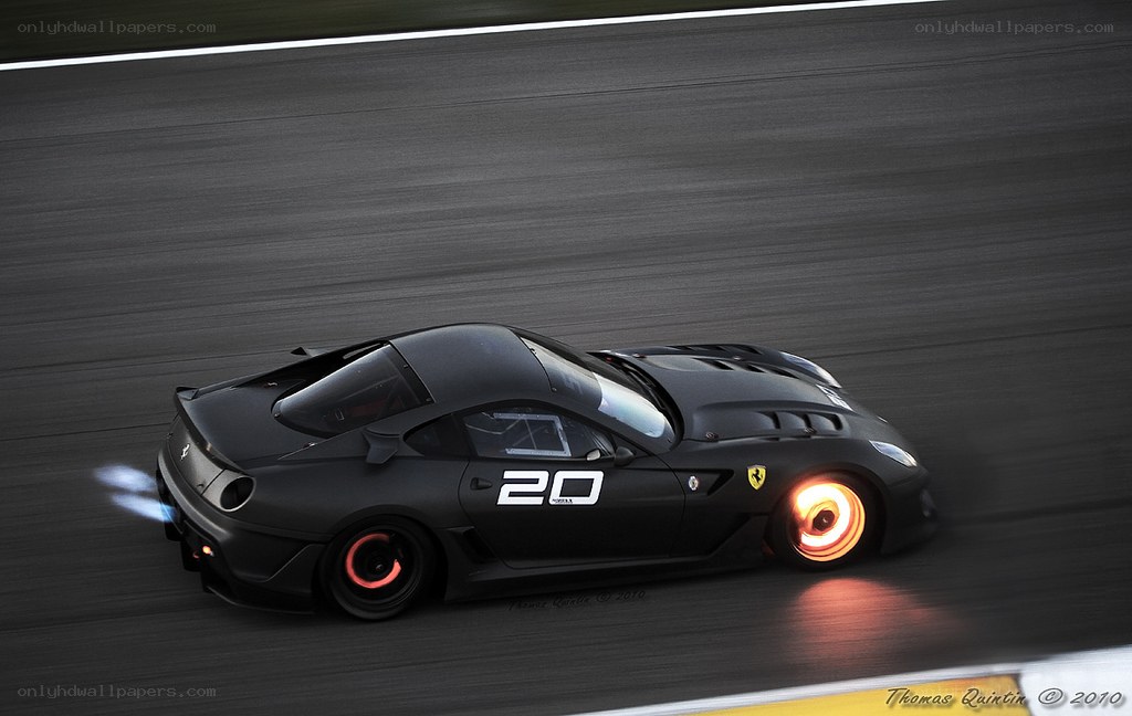 black ferrari on racetrack