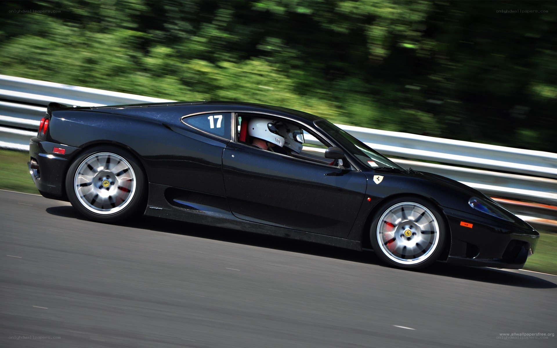 black ferrari on racetrack
