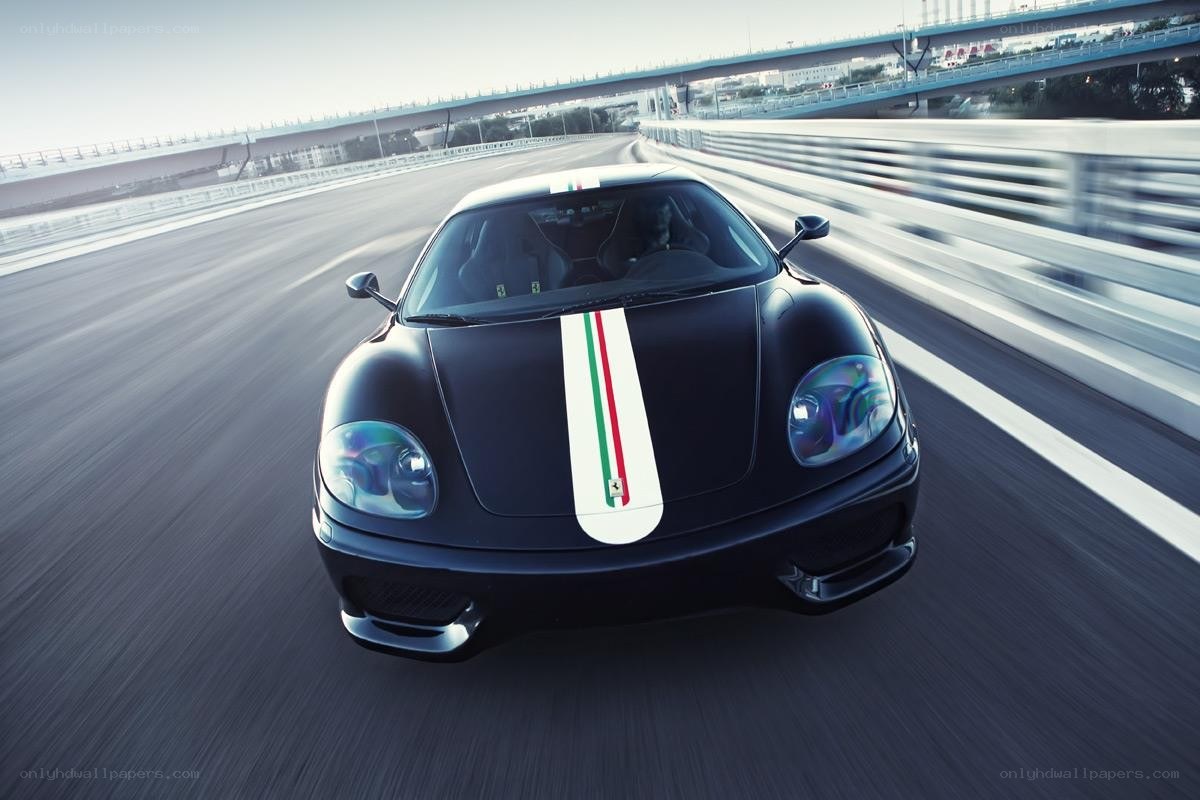 black ferrari on racetrack