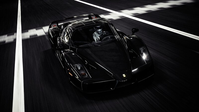 black ferrari on racetrack