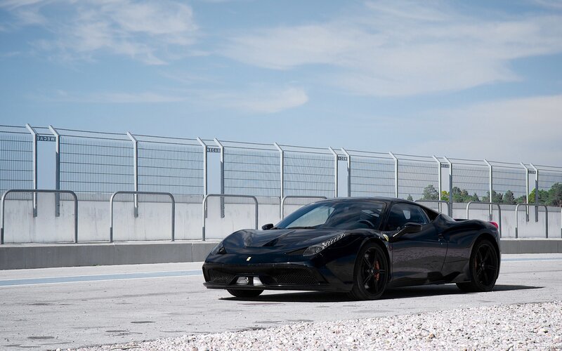 Black Ferrari on Racetrack — Calm