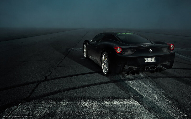 black ferrari on racetrack