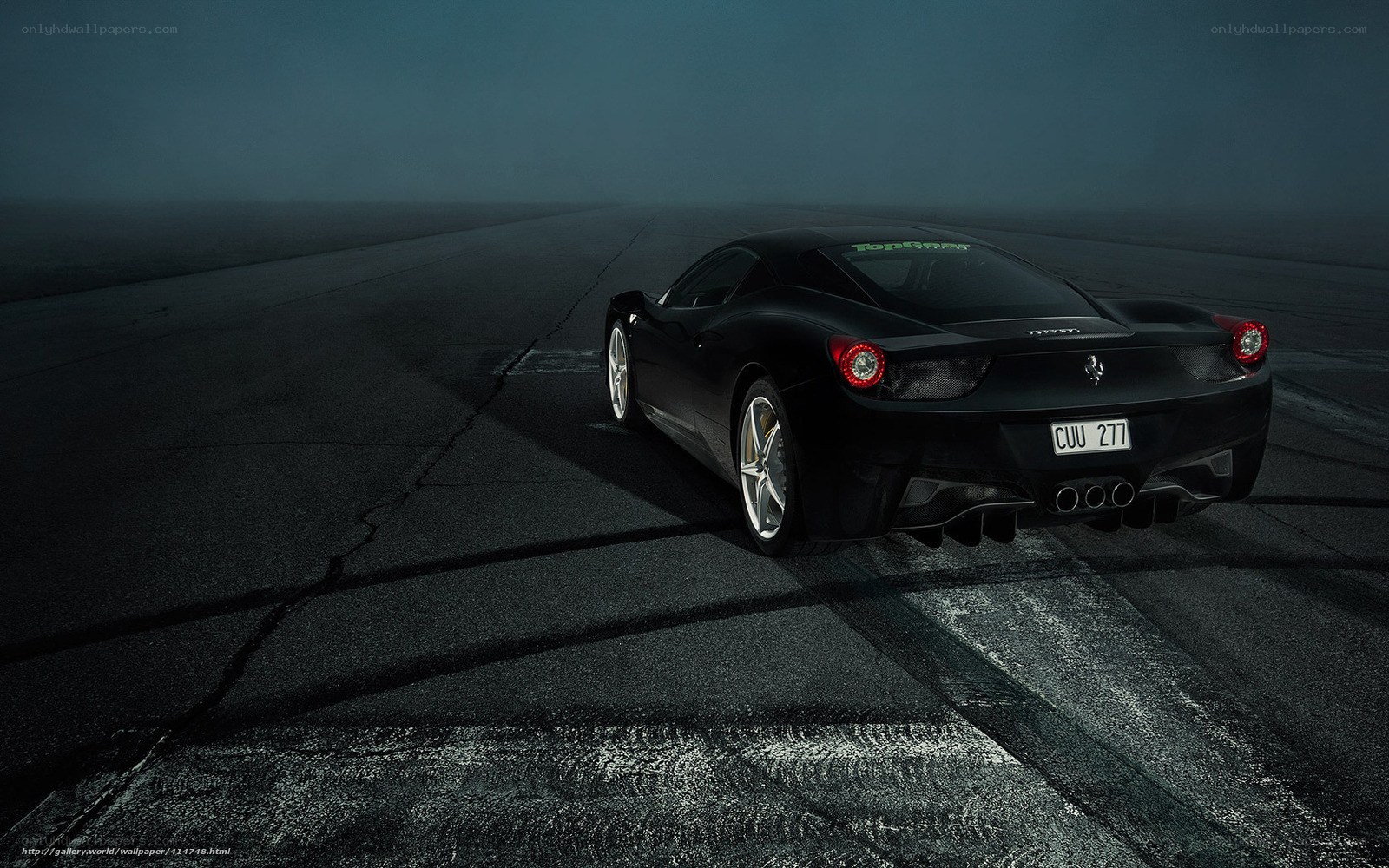 black ferrari on racetrack