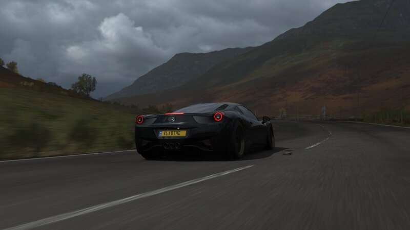 Black Ferrari on Road — Dramatic