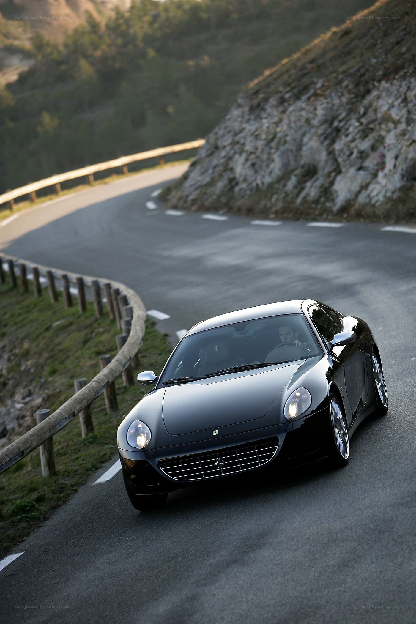 Black Ferrari on winding road
