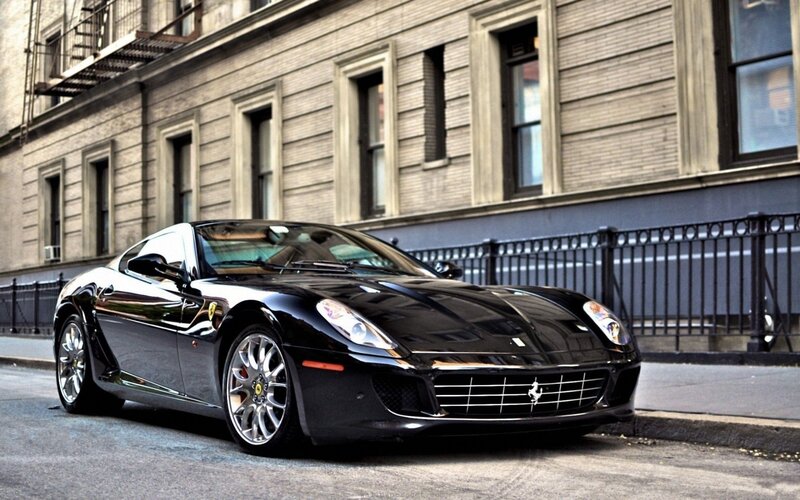 Black Ferrari parked on city street